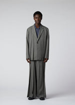 A model wears the IM Men WOOL LIKE TWEED trousers.