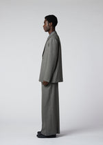 A model wears the IM Men WOOL LIKE TWEED trousers.