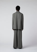 A model wears the IM Men WOOL LIKE TWEED trousers.