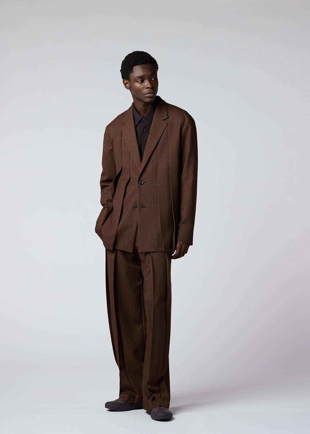 A model wears the IM Men WOOL LIKE TWEED trousers.