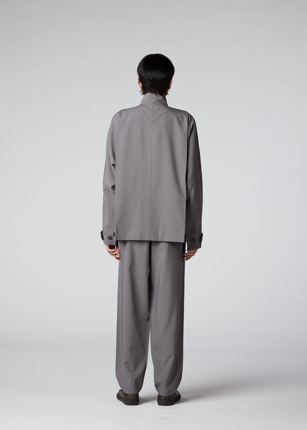 A model wears the IM Men FLAT trousers.