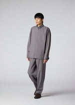 A model wears the IM Men FLAT trousers.