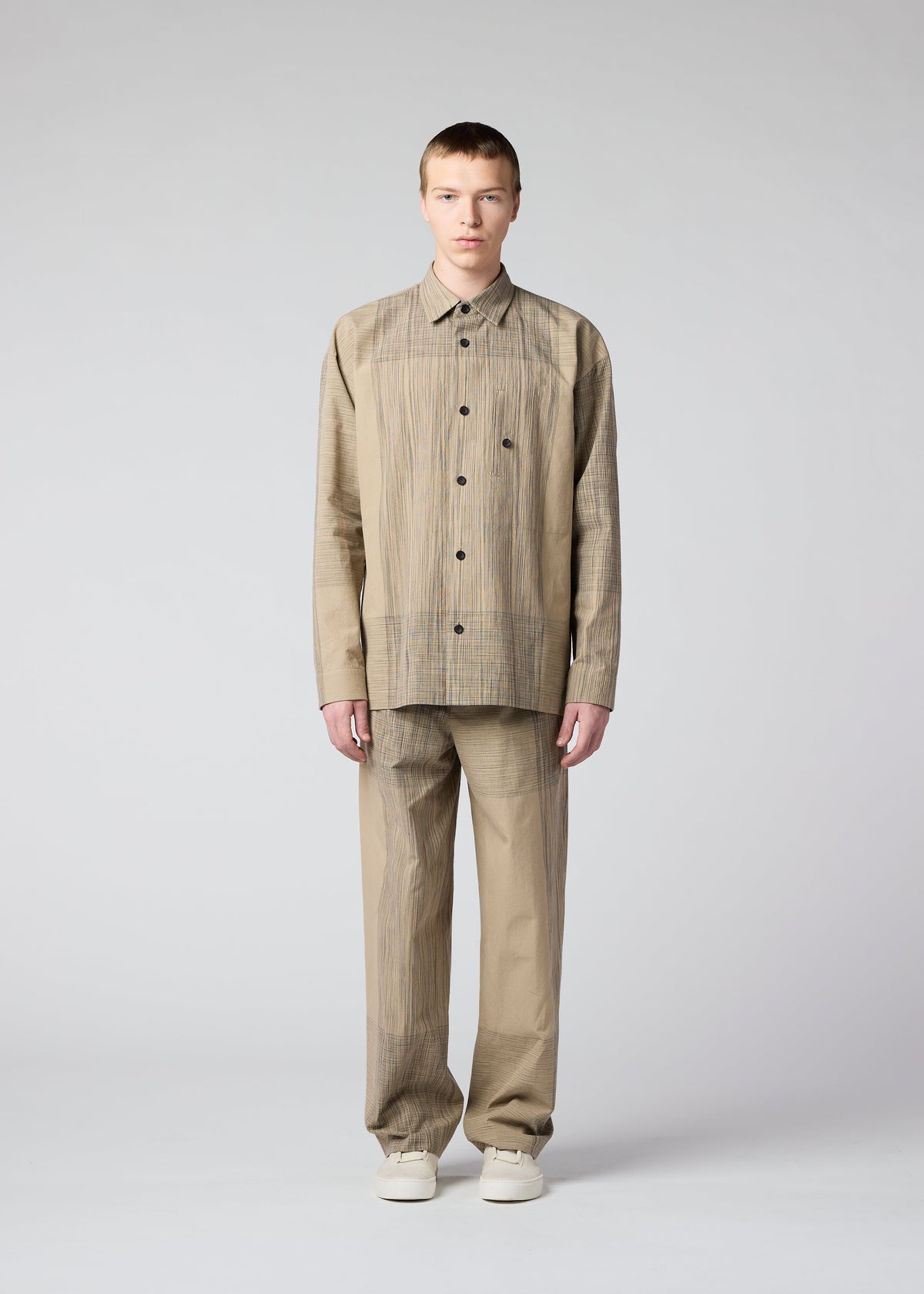 A model wears the IM MEN KASURI shirt.