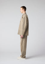 A model wears the IM MEN KASURI shirt.