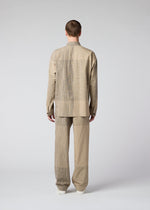 A model wears the IM MEN KASURI shirt.