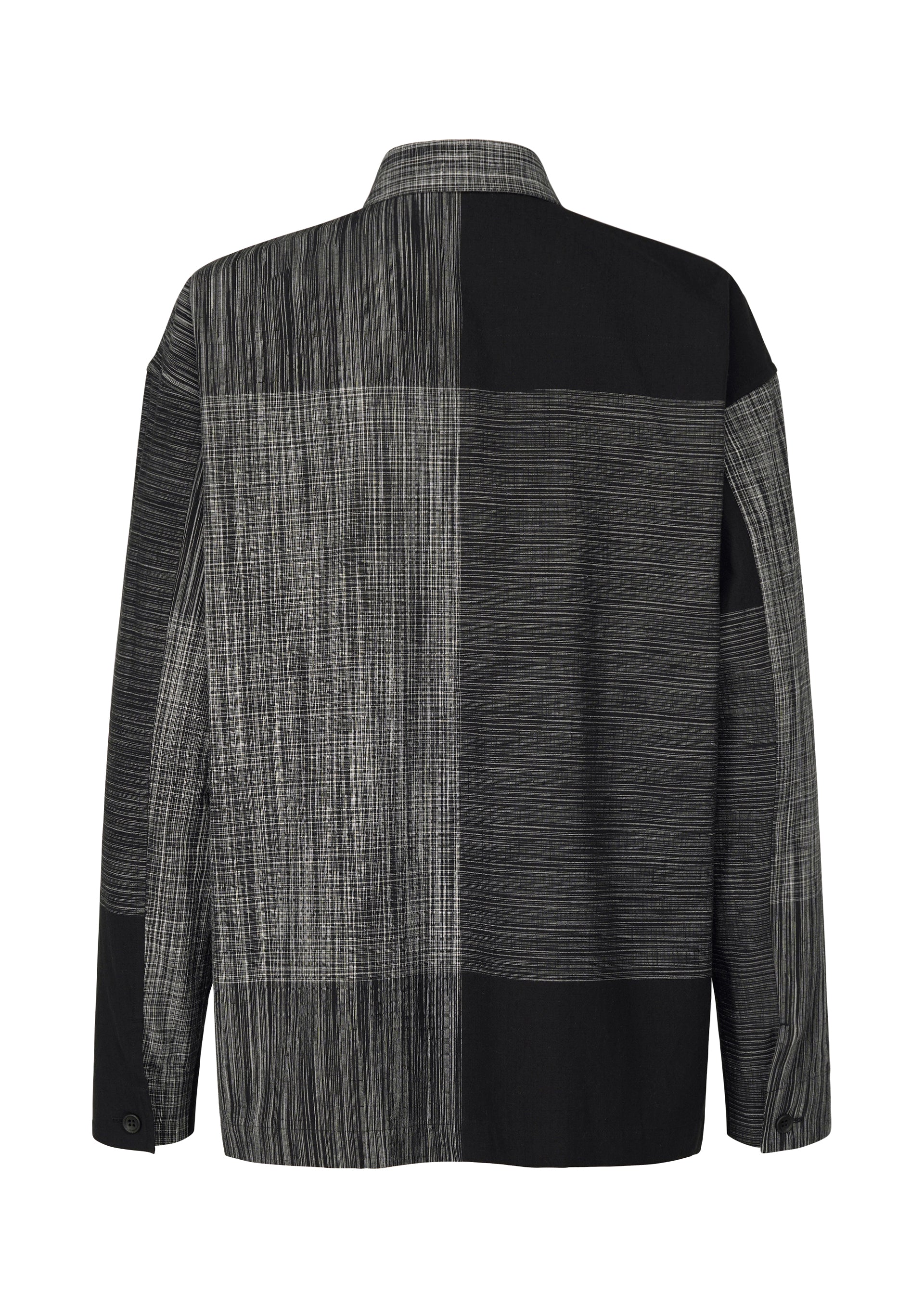 A detail shot of the IM MEN KASURI shirt.