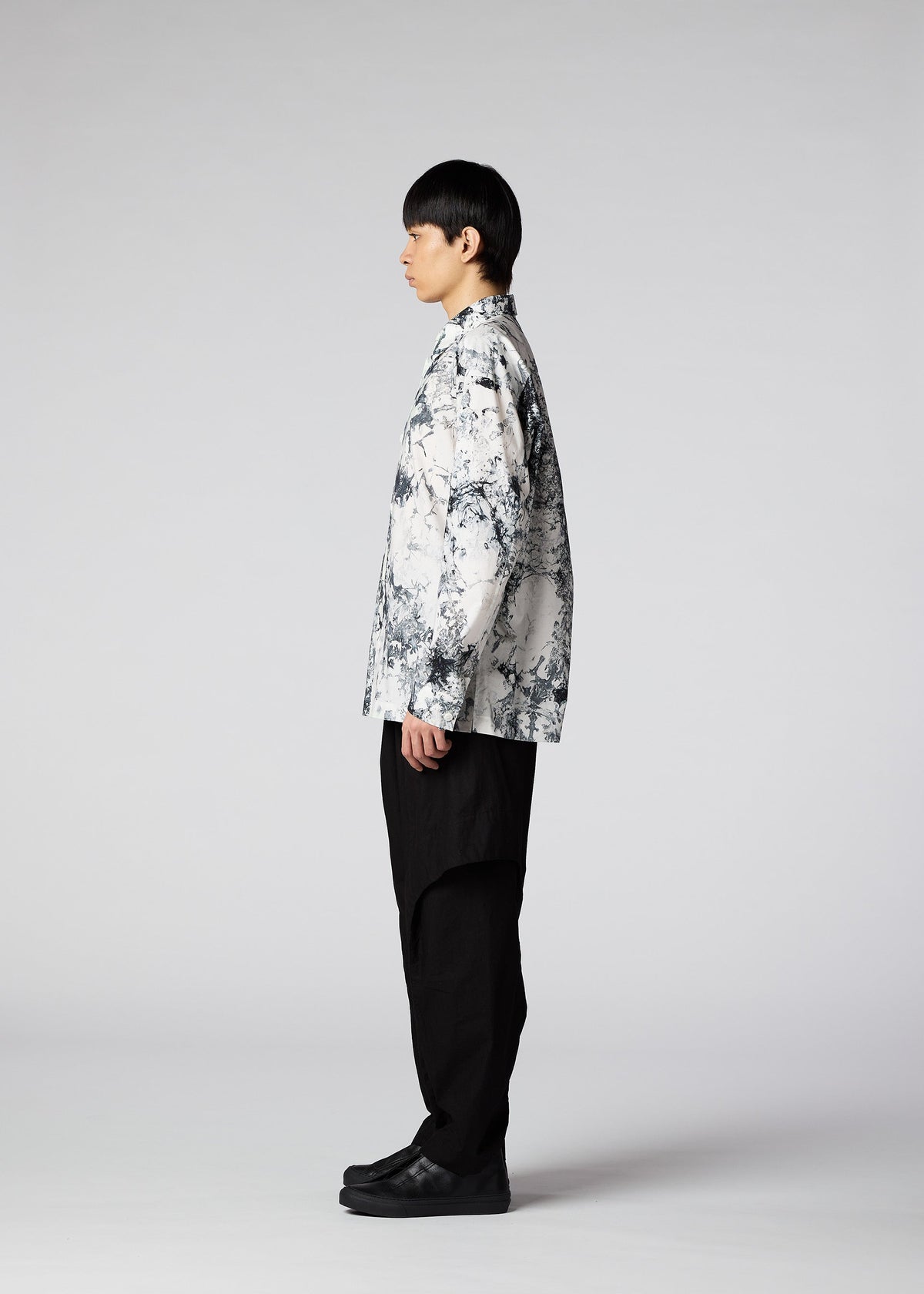 A model wears the IM Men ROKETSU shirt.