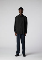 A model wears the IM Men PLEATS SHIRT shirt.