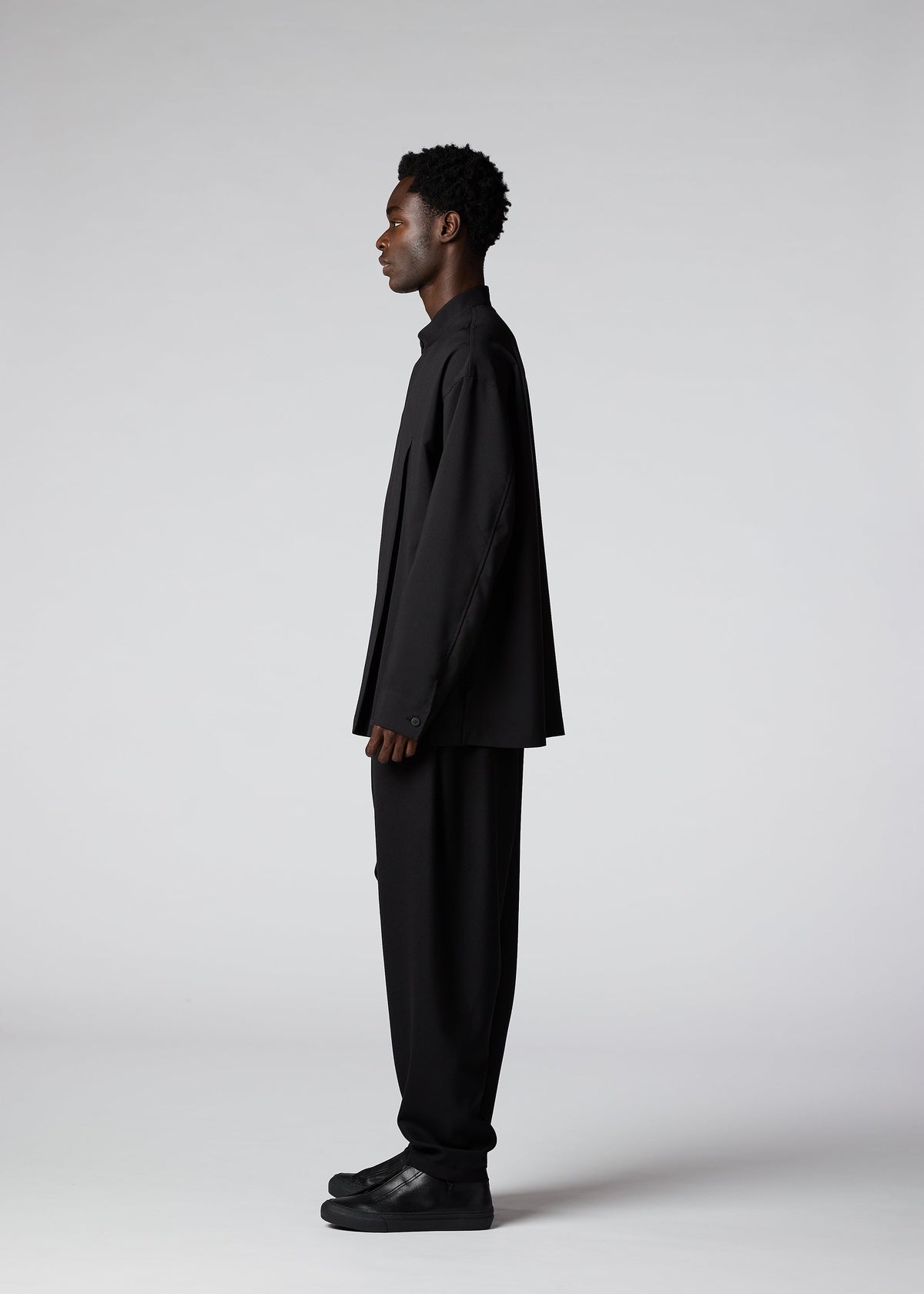 A model wears the IM Men WINGS SHIRT shirt.