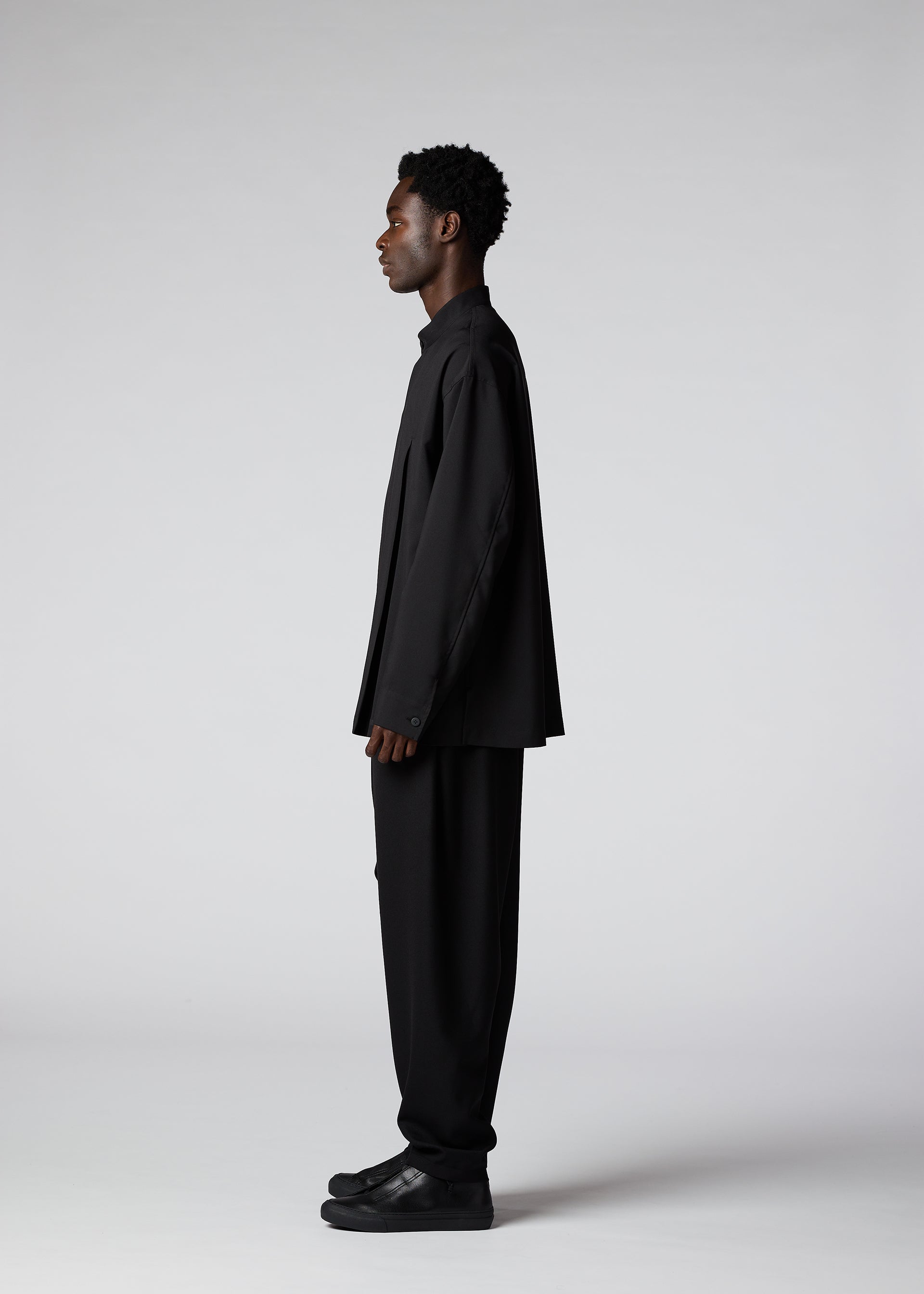 A model wears the IM Men WINGS SHIRT shirt.