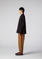 A model wears the IM Men DOUBLE WEAVE CREPE shirt.
