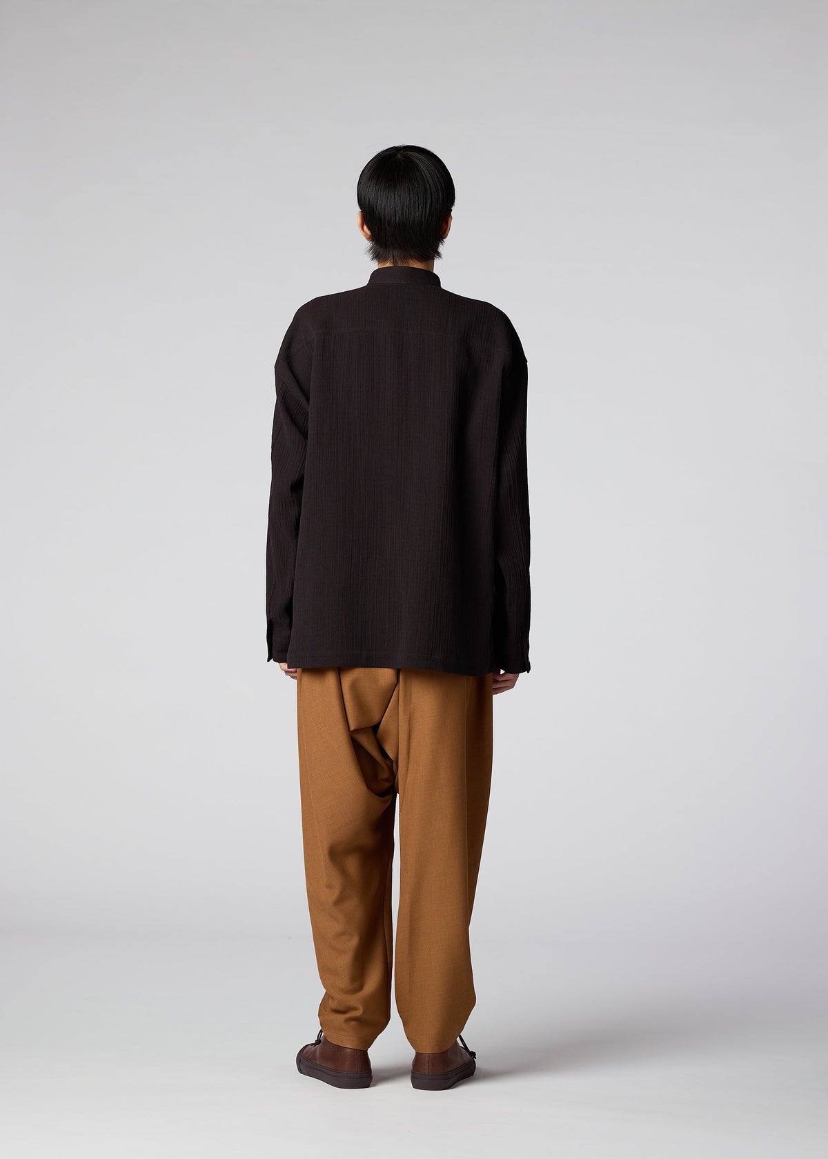A model wears the IM Men DOUBLE WEAVE CREPE shirt.