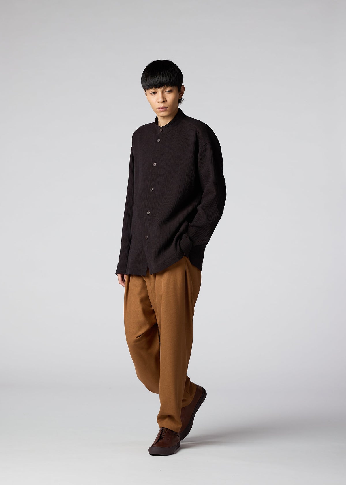 A model wears the IM Men DOUBLE WEAVE CREPE shirt.