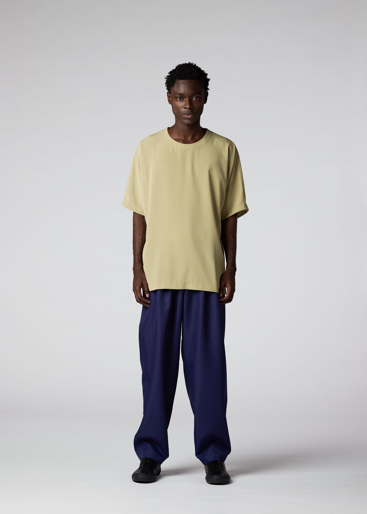 A model wears the IM MEN CREPE T top.