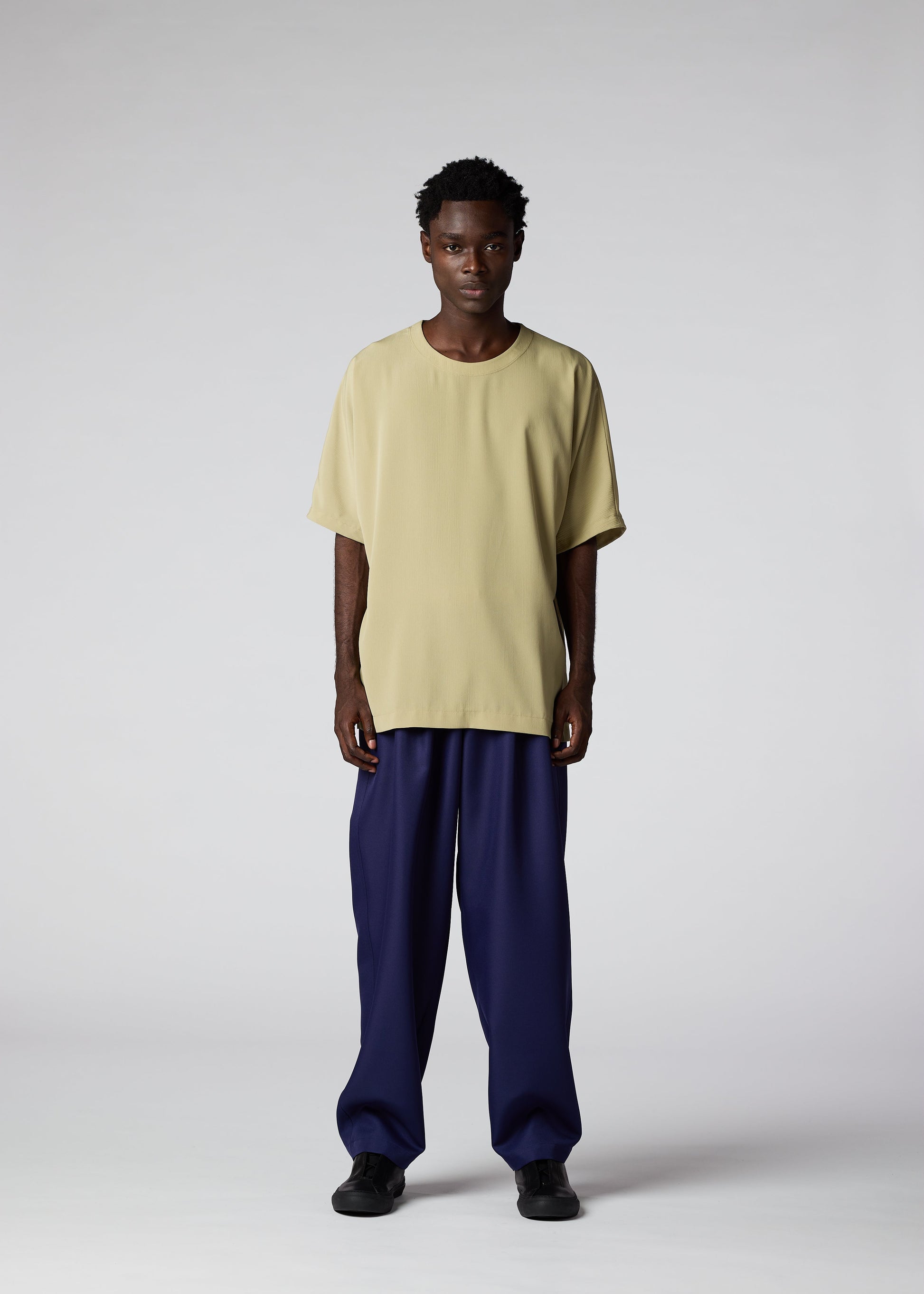 A model wears the IM MEN CREPE T top.