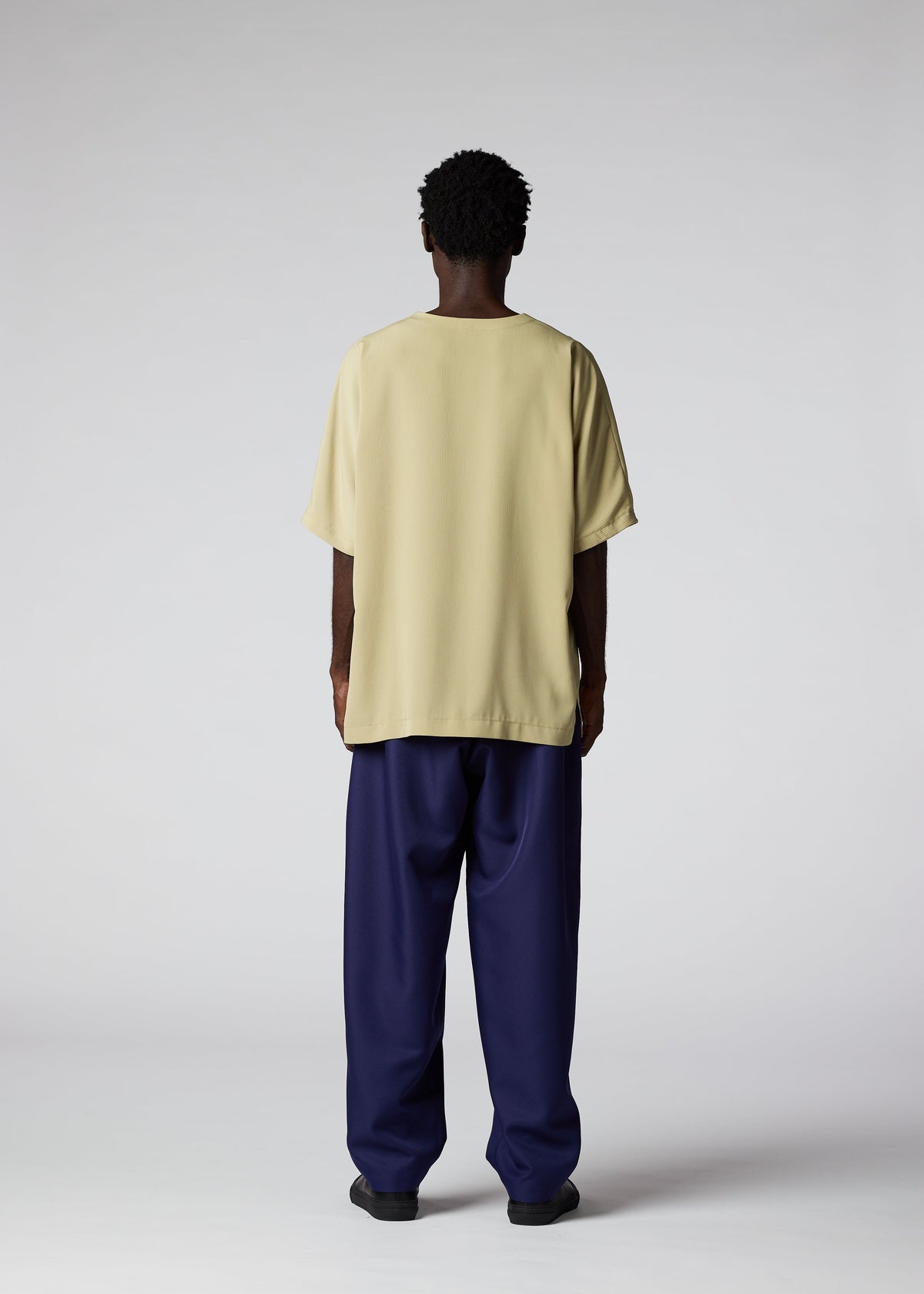 A model wears the IM MEN CREPE T top.