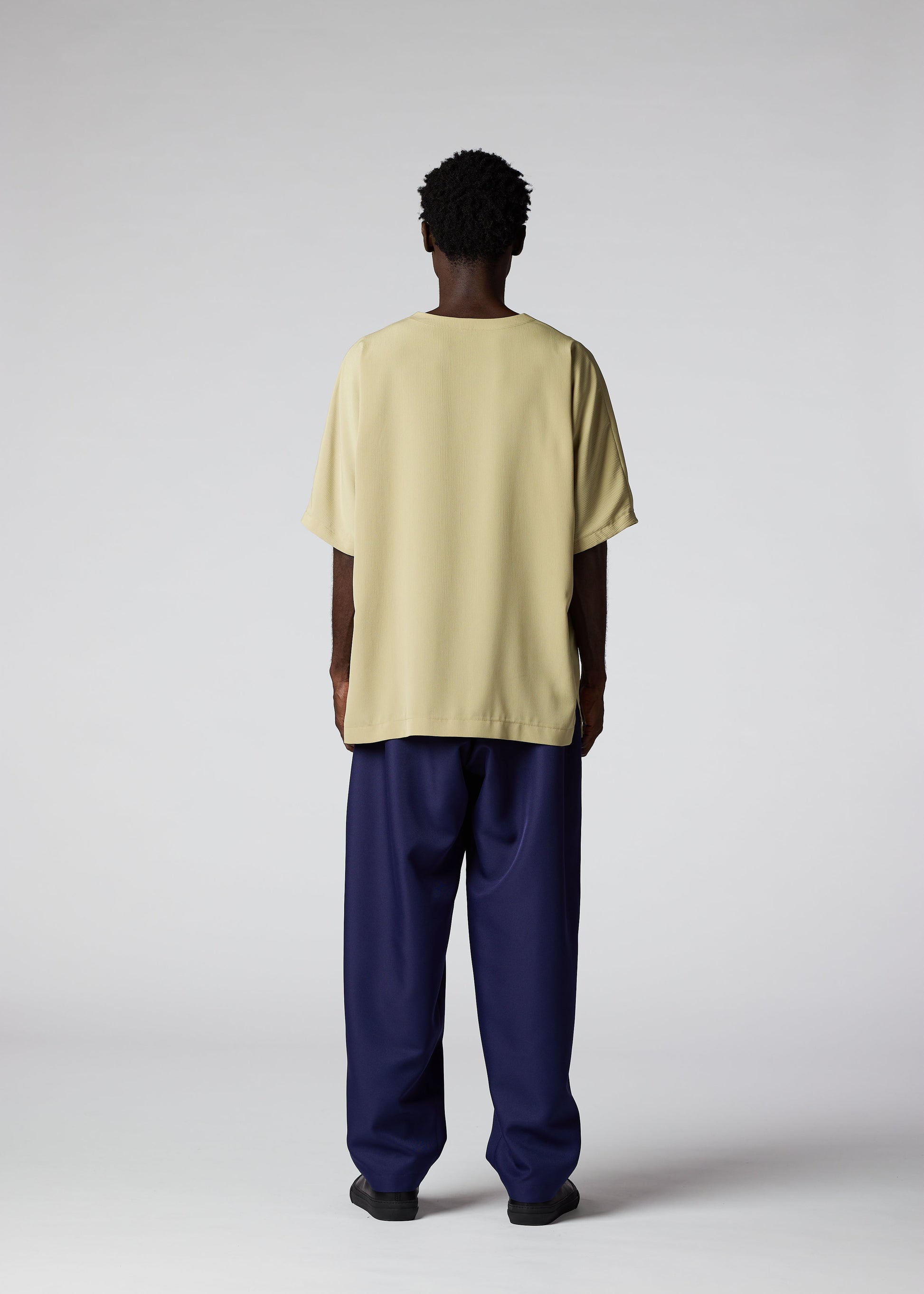 A model wears the IM MEN CREPE T top.