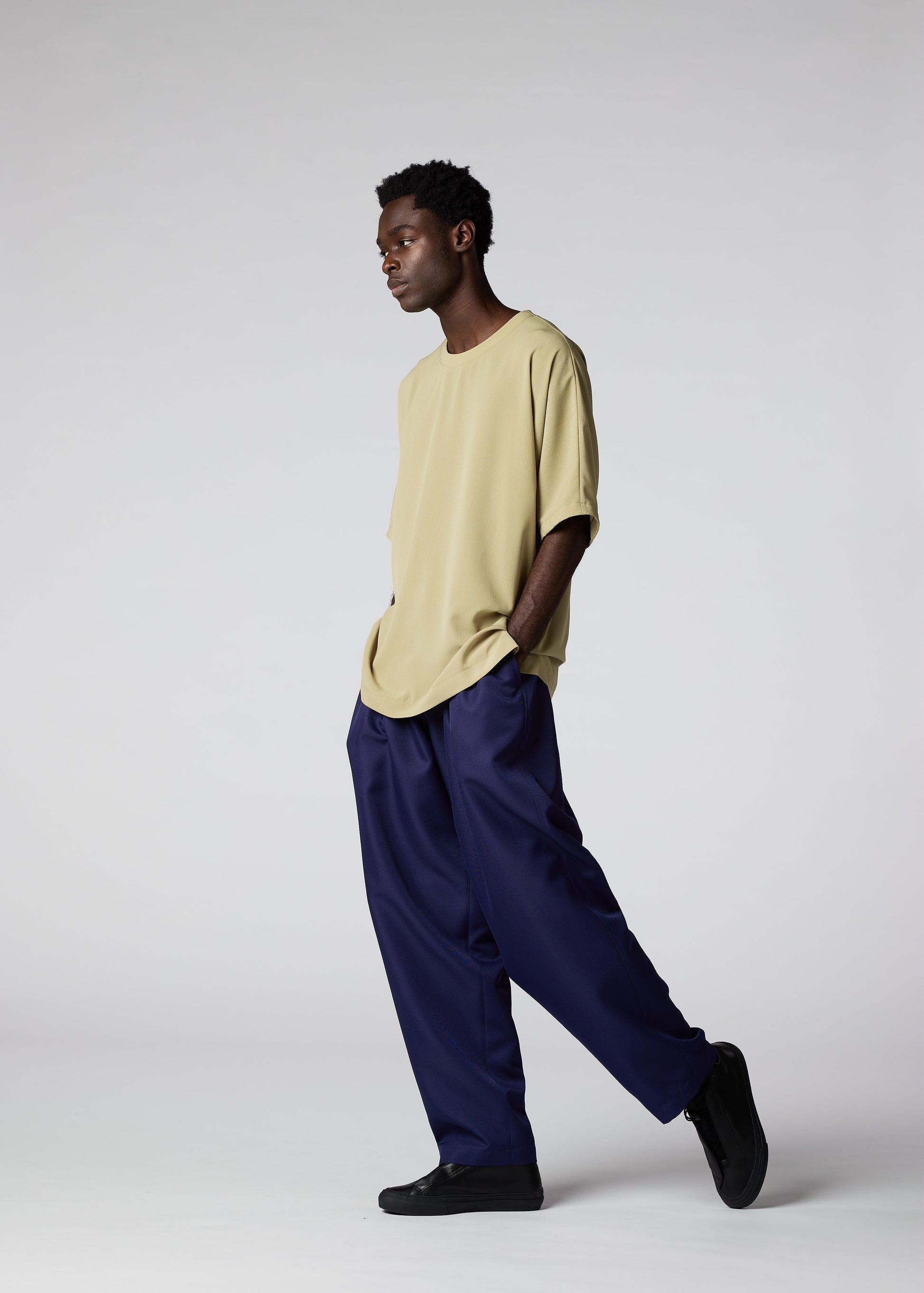 A model wears the IM MEN CREPE T top.