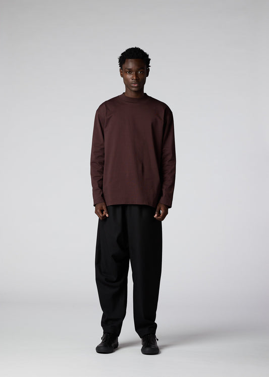 A model wears the IM Men 402 JERSEY STITCH top.