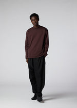 A model wears the IM Men 402 JERSEY STITCH top.