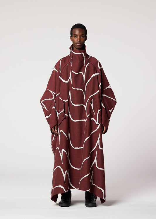 A model wears the IM MEN EARTH prêt à porter.