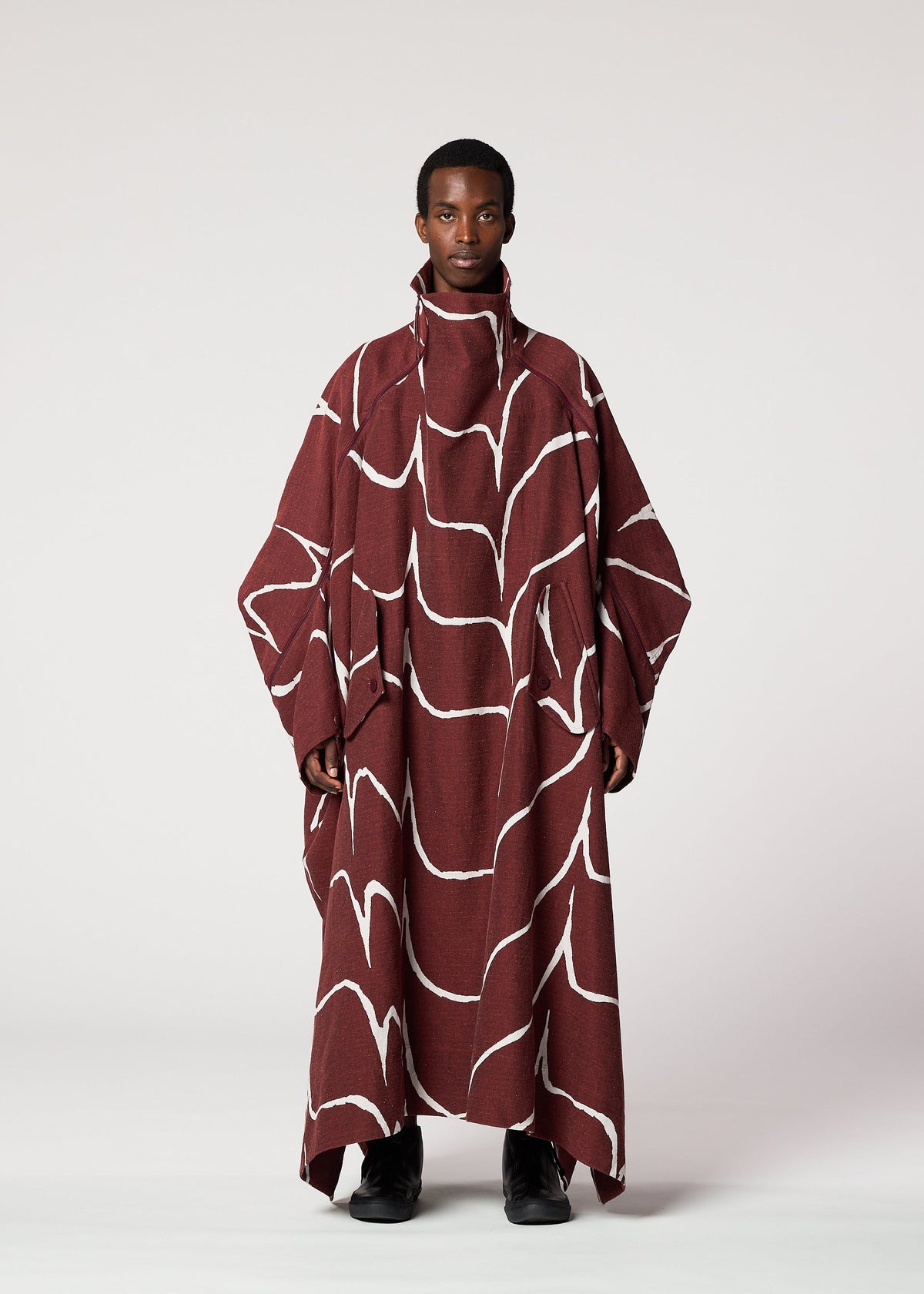 A model wears the IM MEN EARTH prêt à porter.