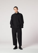 A model wears the IM MEN FLAT BLACK prêt à porter.