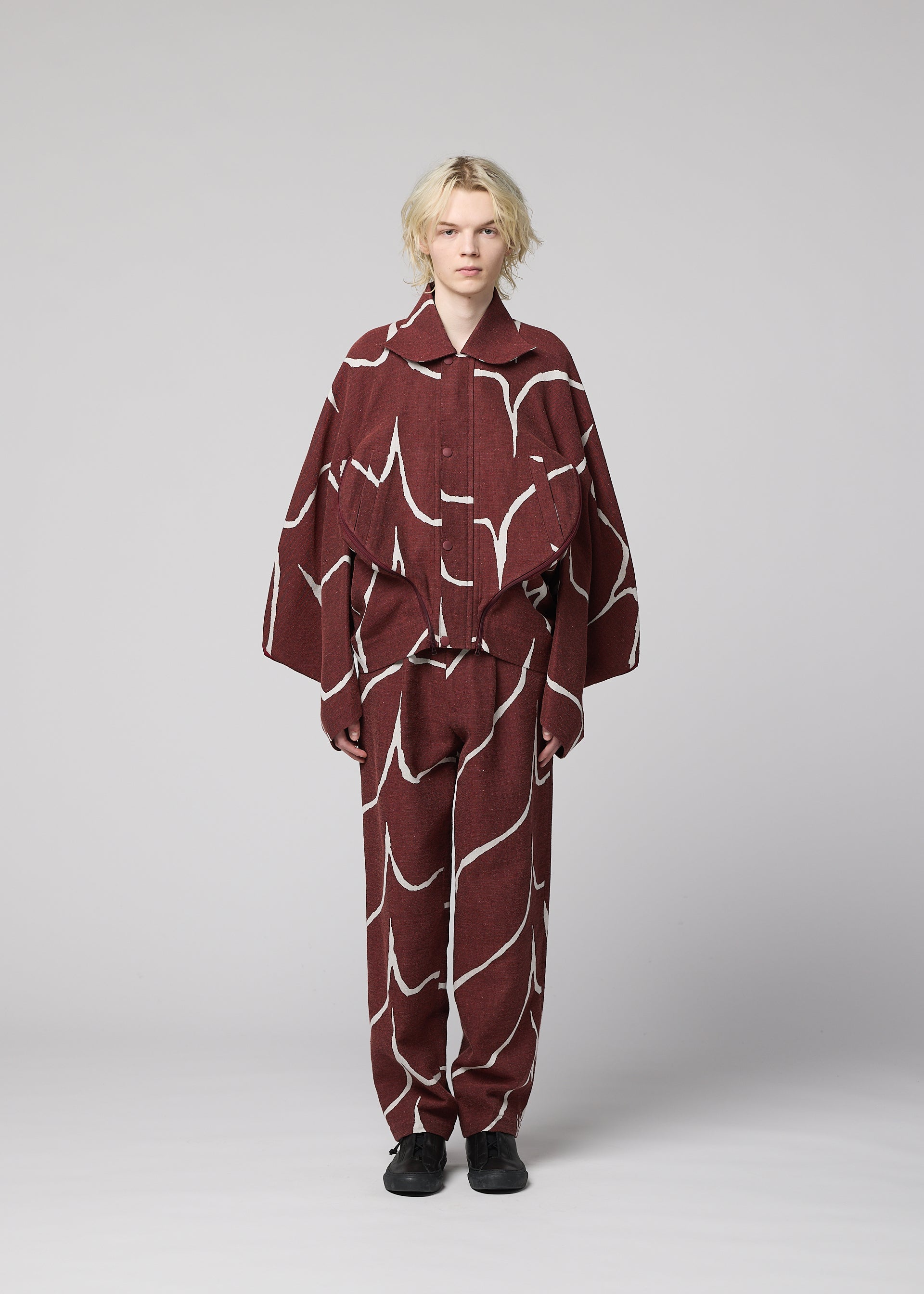 A model wears the IM MEN EARTH prêt à porter.