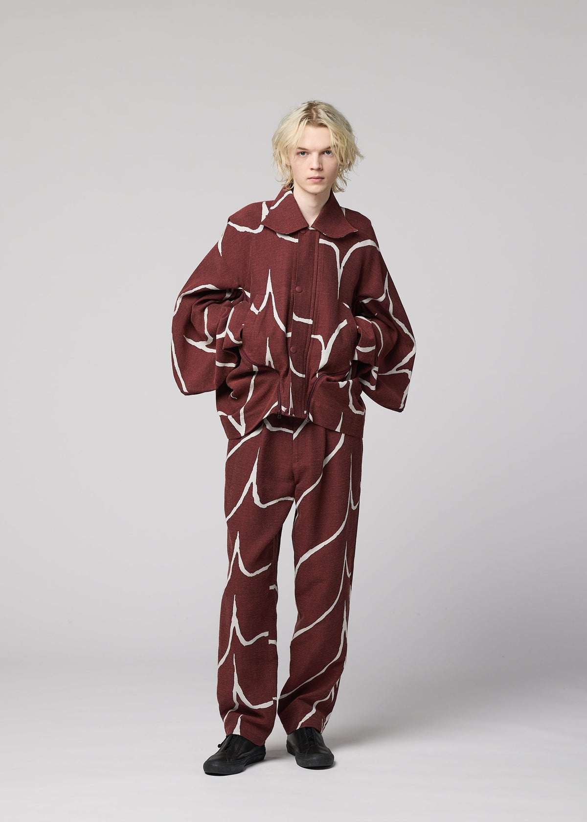 A model wears the IM MEN EARTH prêt à porter.