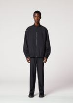 A model wears the IM Men AIR PLEATS prêt à porter.