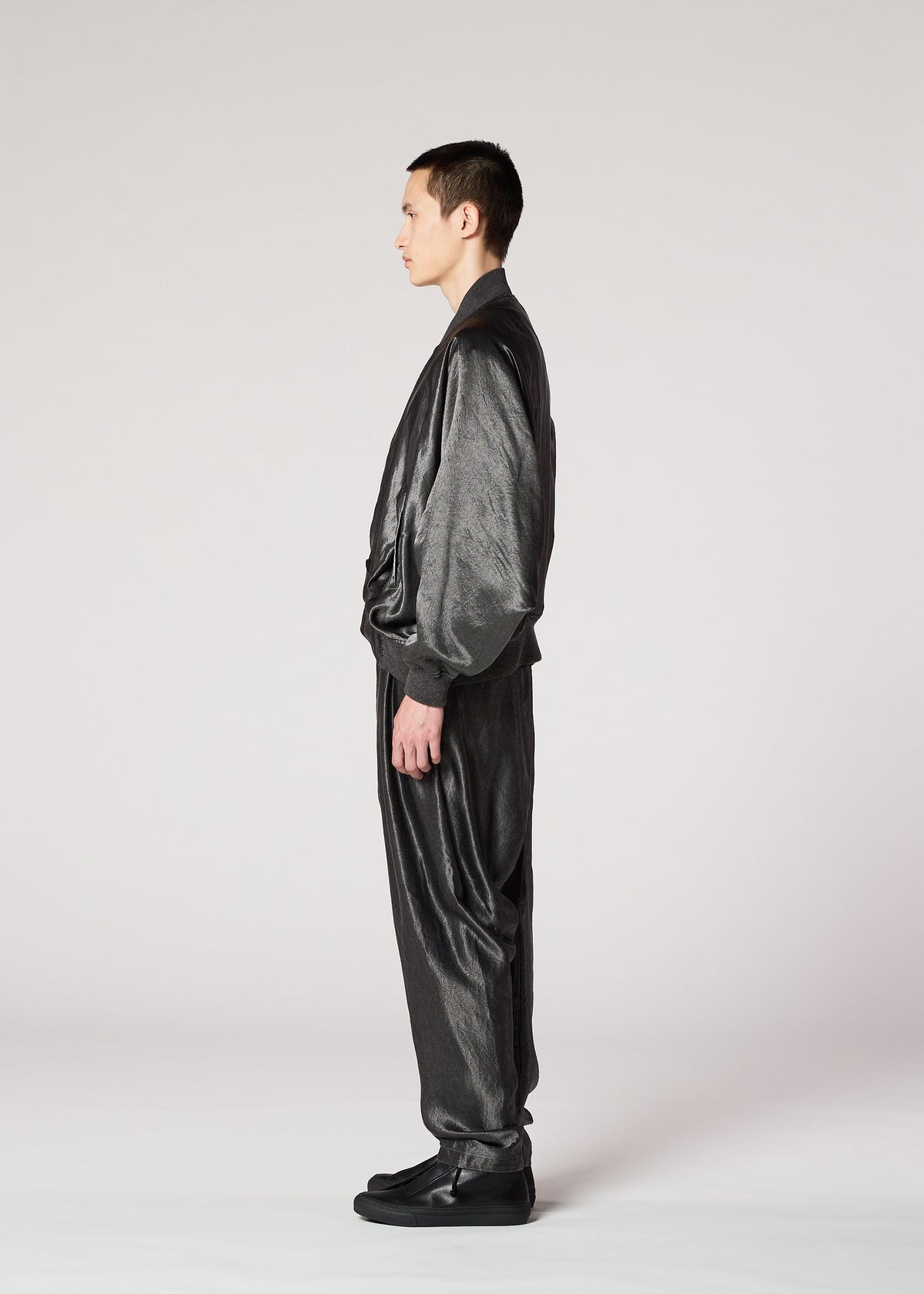 A model wears the IM Men SATIN WASH jacket.