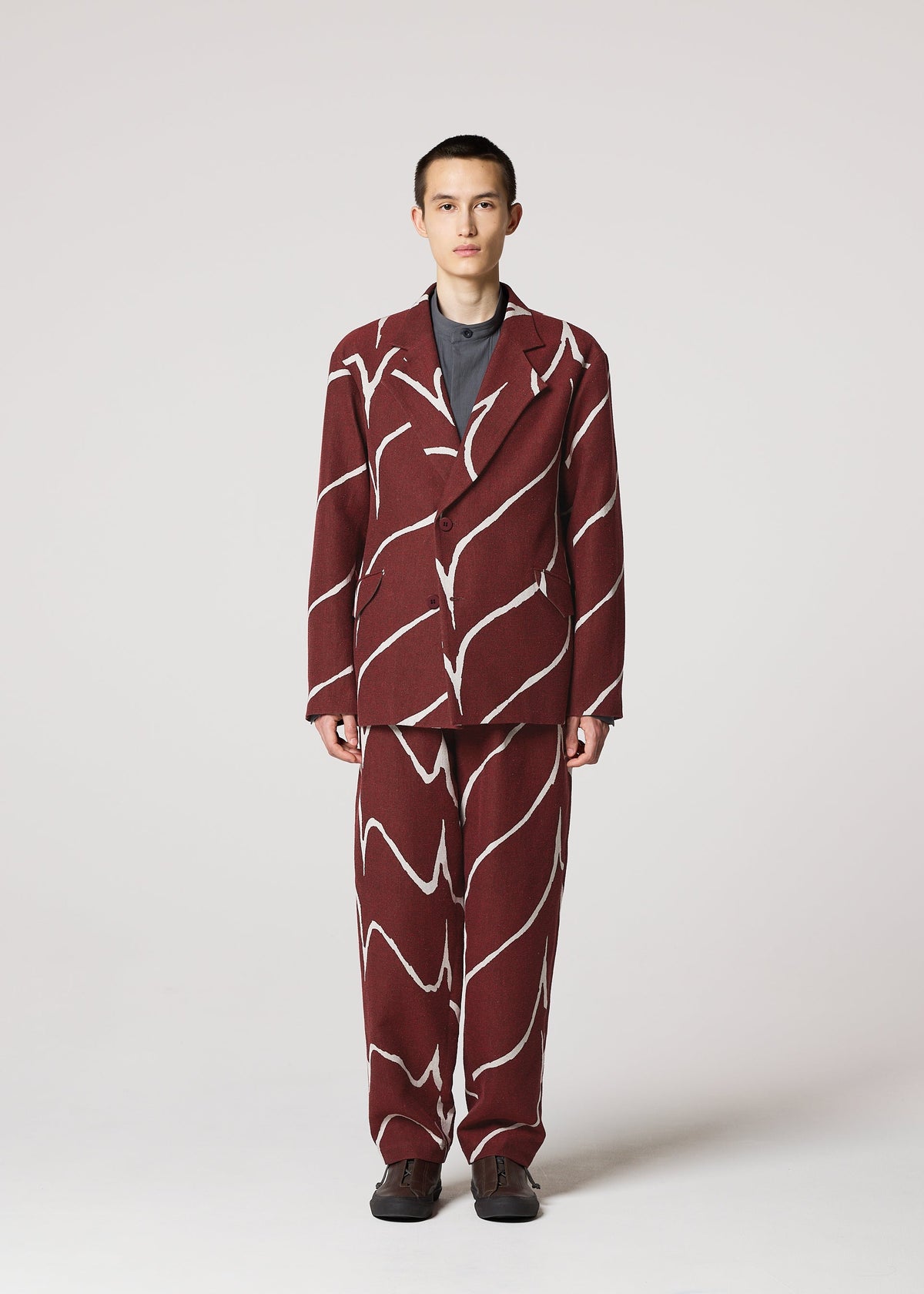 A model wears the IM MEN EARTH prêt à porter.