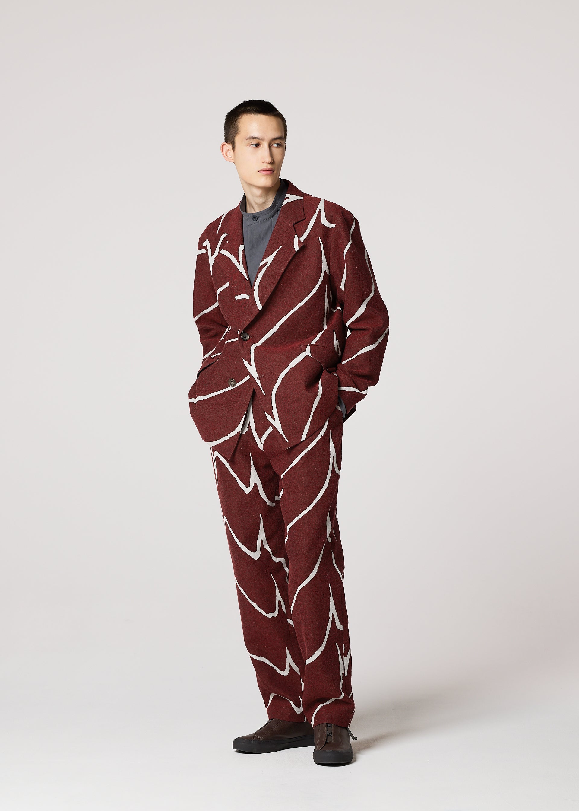 A model wears the IM MEN EARTH prêt à porter.