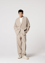 A model wears the IM MEN FLAT prêt à porter.