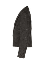 A detail shot of the IM Men UROKOMON prêt à porter.