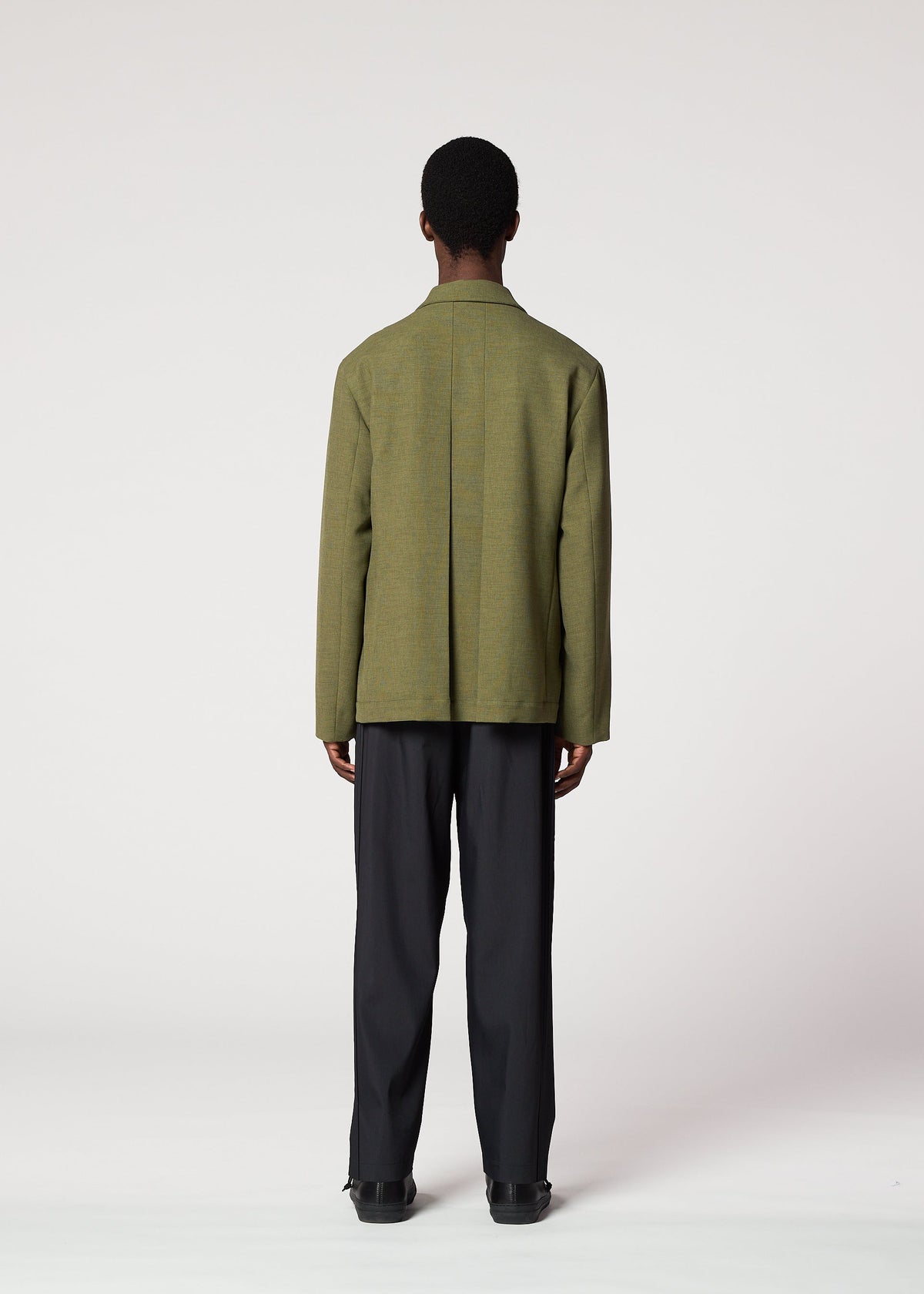 A model wears the IM Men CORNICE jacket.