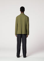 A model wears the IM Men CORNICE jacket.