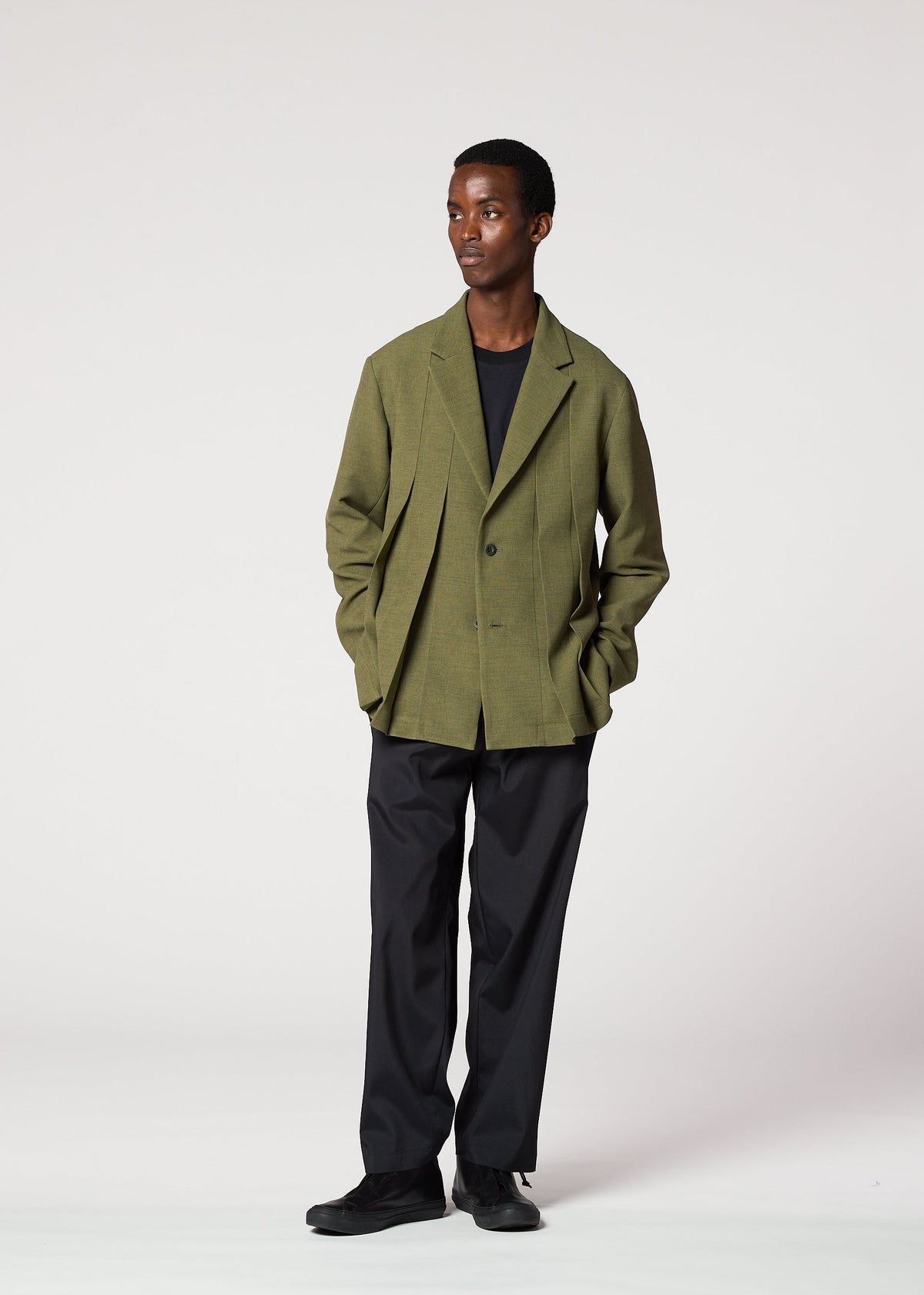 A model wears the IM Men CORNICE jacket.