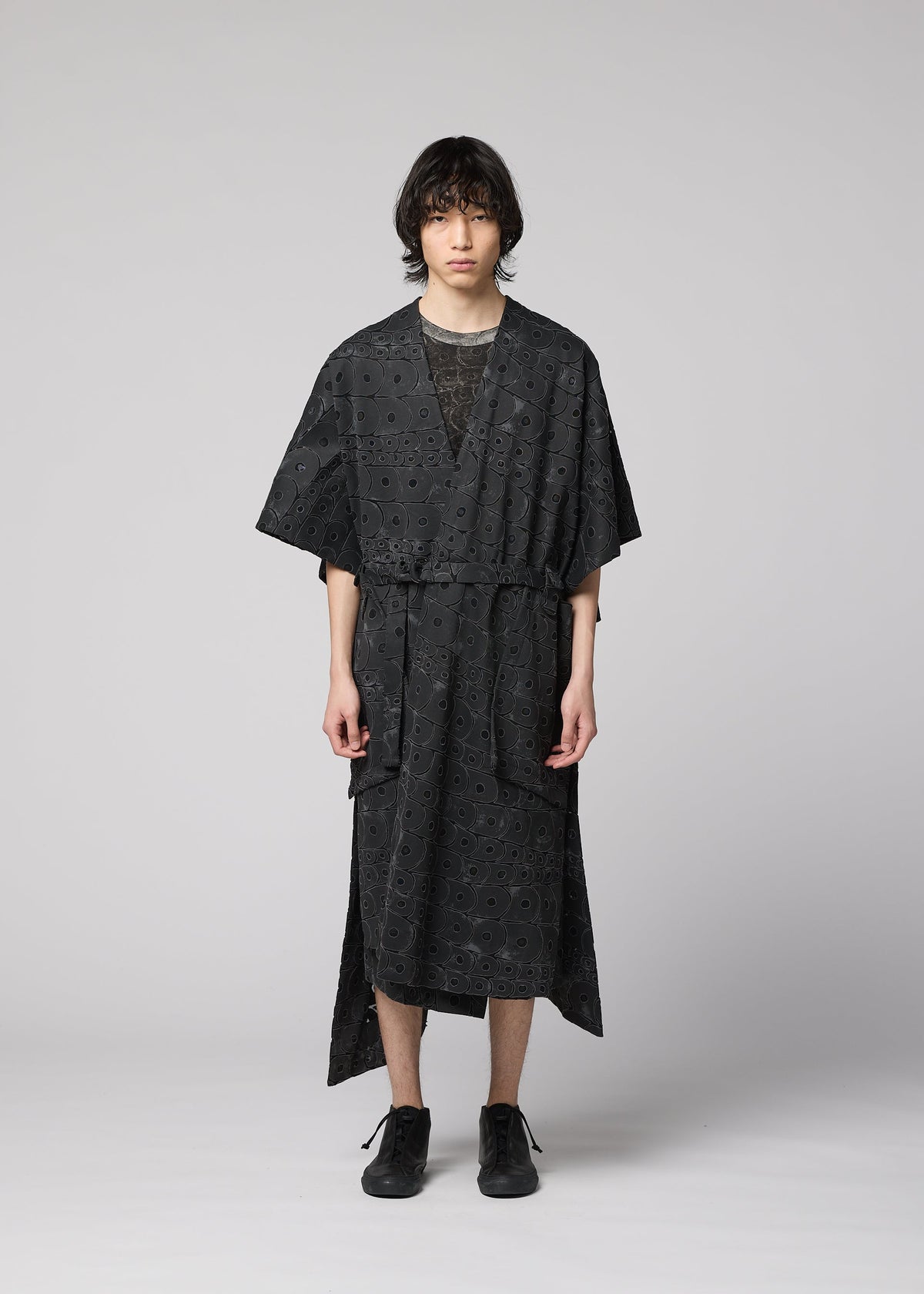 A model wears the IM Men UROKOMON prêt à porter.