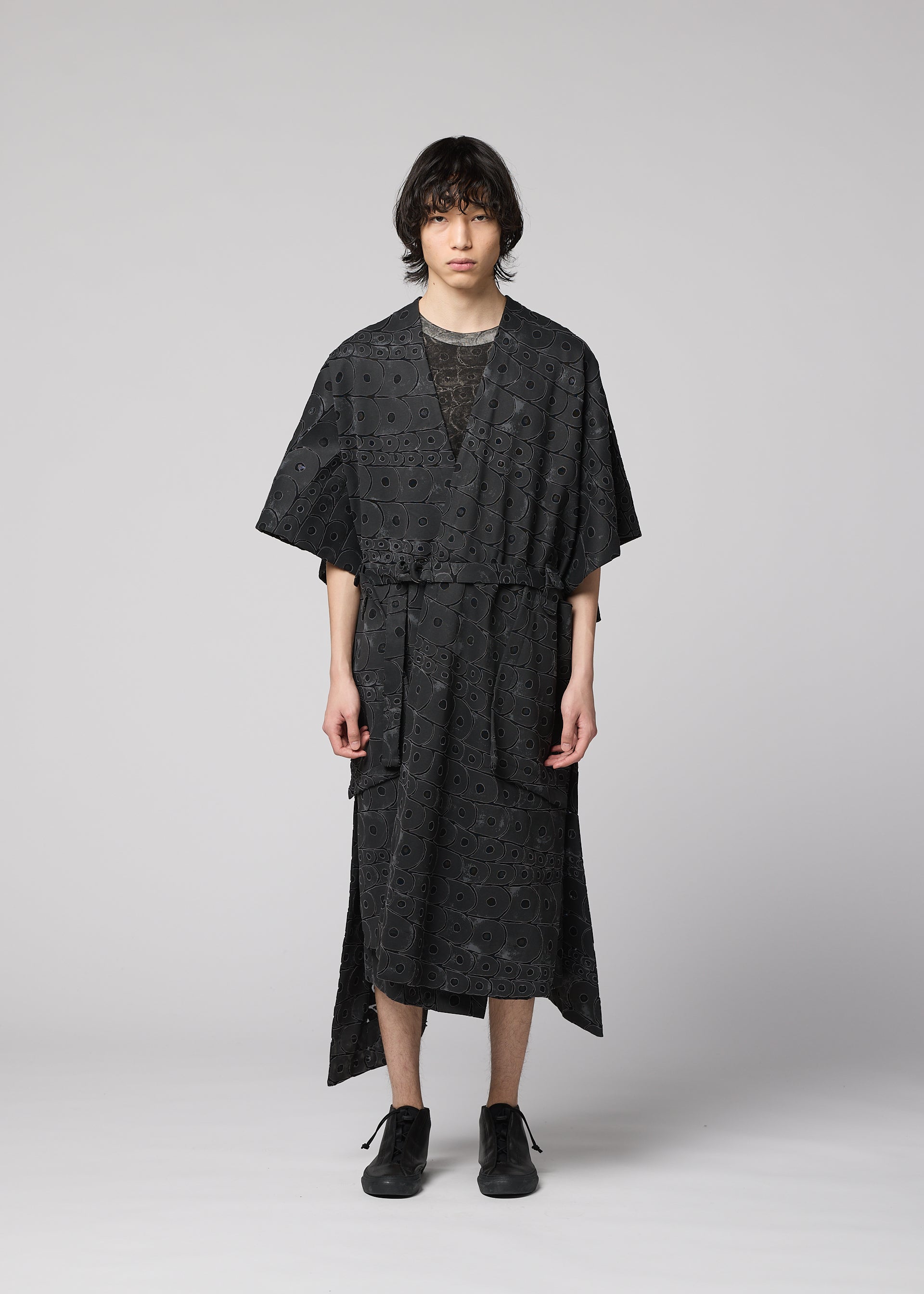 A model wears the IM Men UROKOMON prêt à porter.