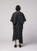A model wears the IM Men UROKOMON prêt à porter.