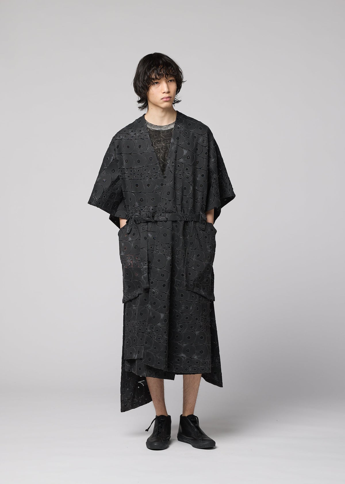 A model wears the IM Men UROKOMON prêt à porter.