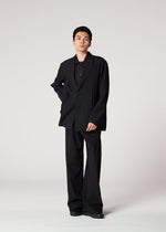 A model wears the IM MEN WINGS BLACK prêt à porter.