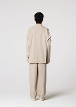 A model wears the IM MEN FLAT prêt à porter.