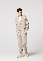 A model wears the IM MEN FLAT prêt à porter.