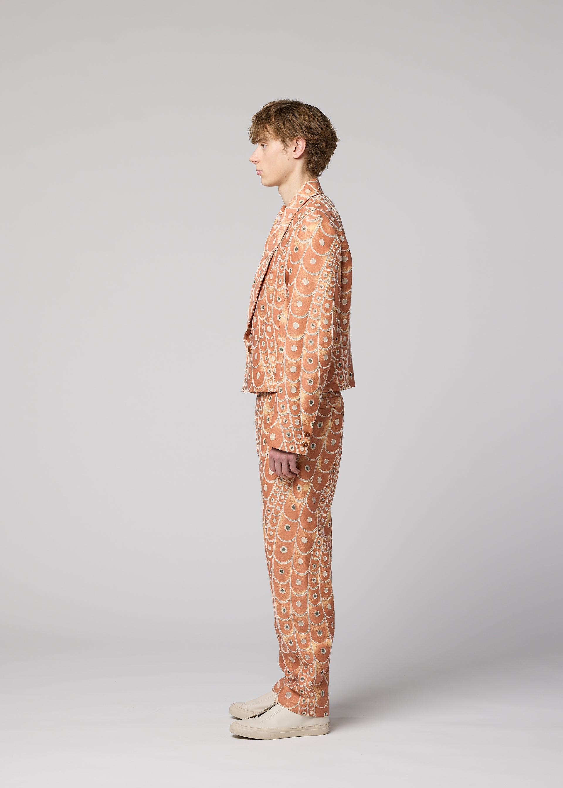 A model wears the IM Men UROKOMON prêt à porter.