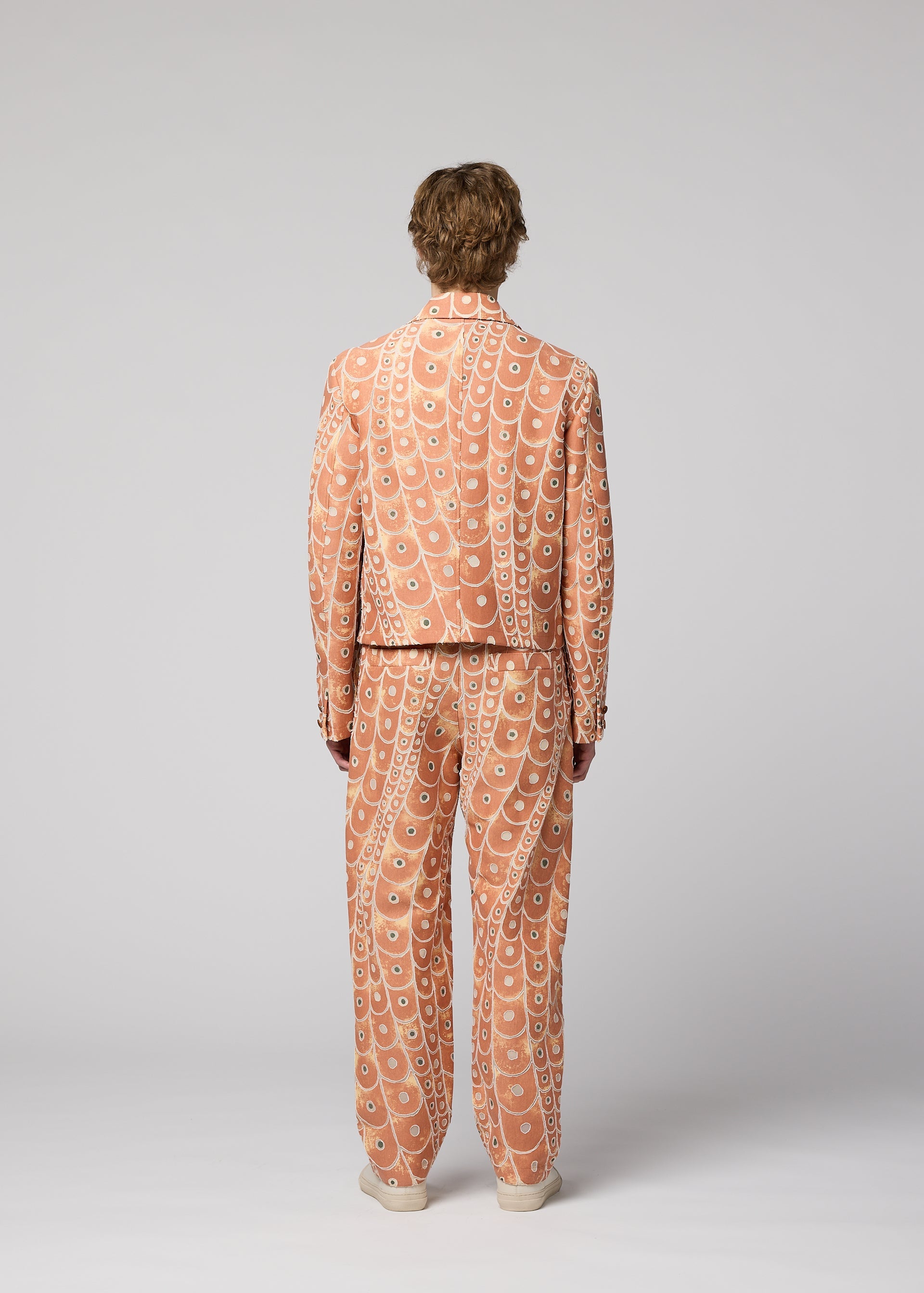 A model wears the IM Men UROKOMON prêt à porter.