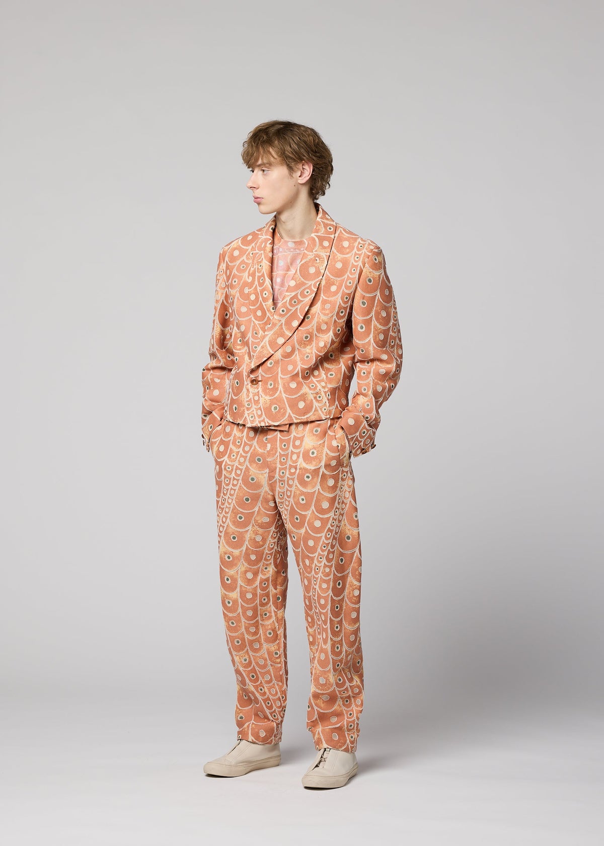 A model wears the IM Men UROKOMON prêt à porter.