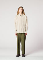 A model wears the IM Men CORNICE trousers.