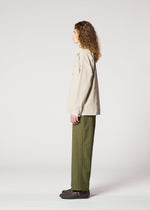 A model wears the IM Men CORNICE trousers.